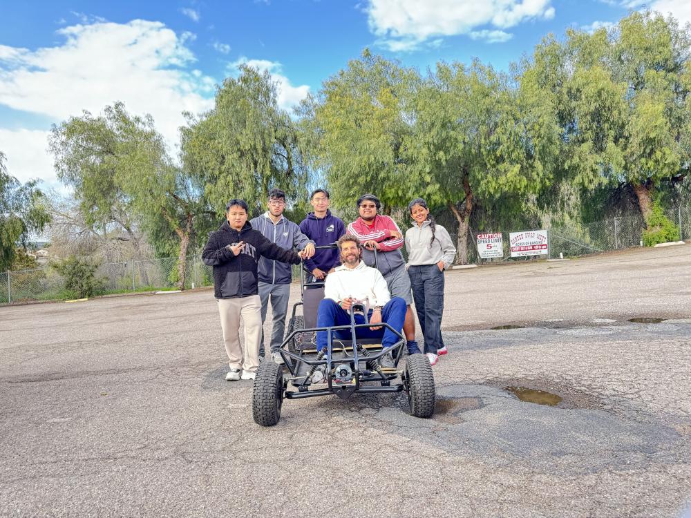 Drive-By-Wire Go-kart with the team (around the go-kart) and sponsor (in the go-kart)