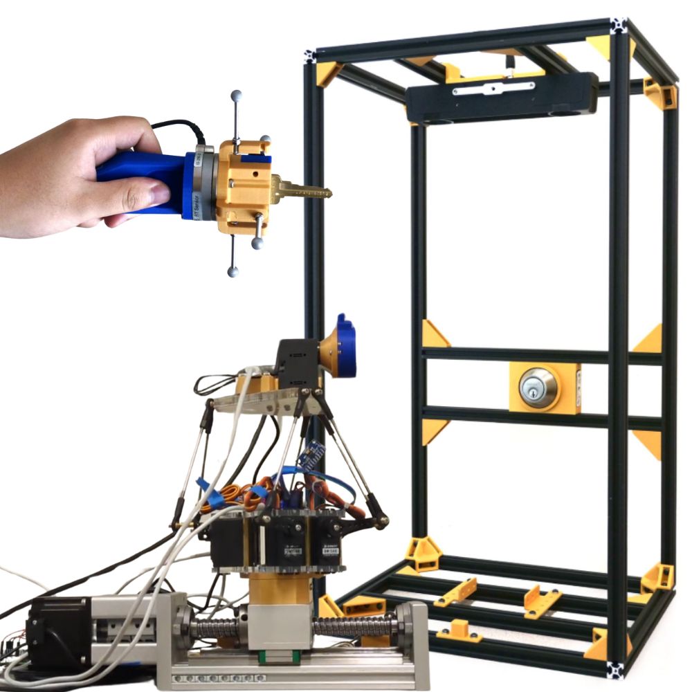 On the left we have a hand holding the Sensor Handle and on the bottom left is the Robotic Arm. These two systems will interact with the testbed on the right.