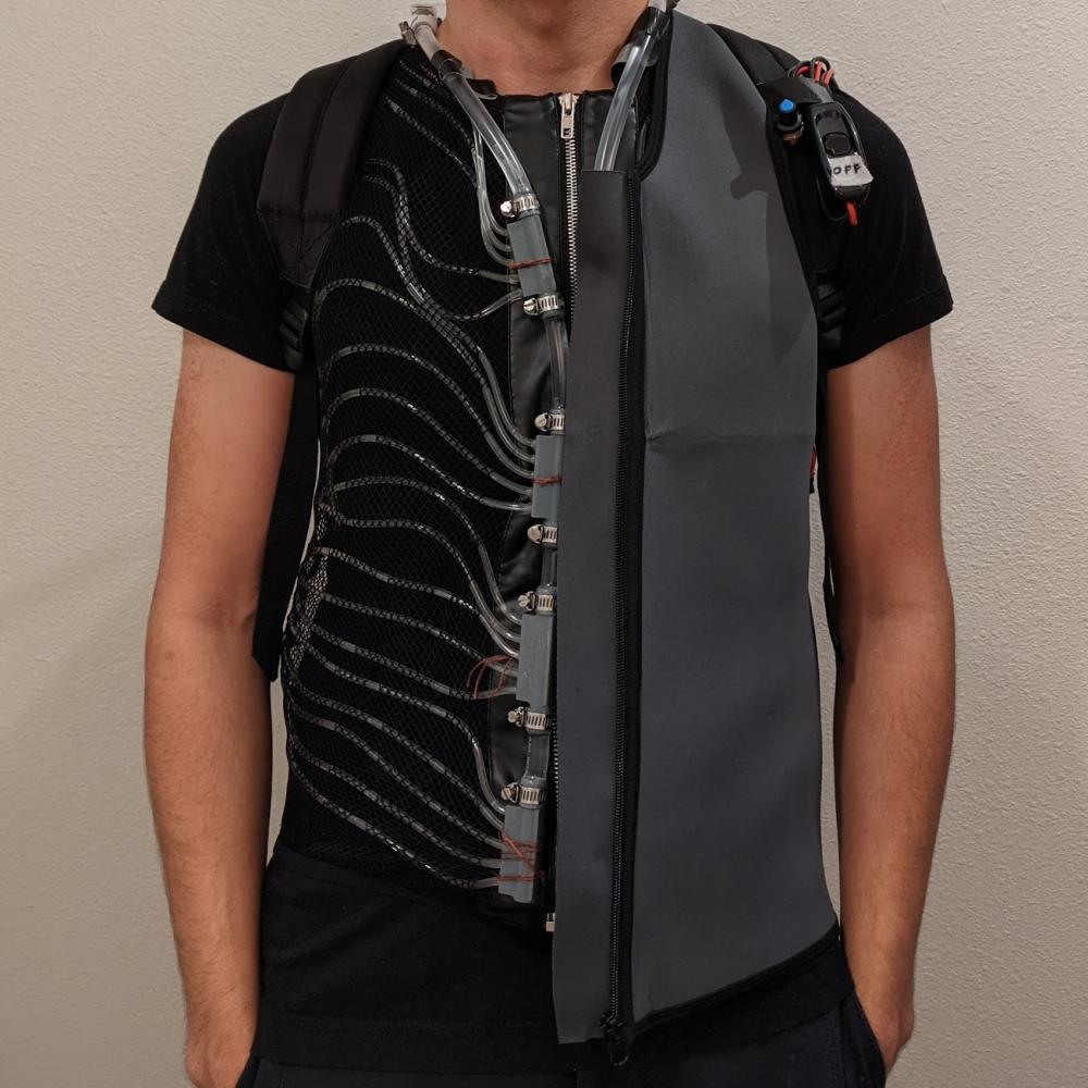 This image depicts the final cooling vest. Both the inner cooling vest with circulating tubing and outer insulation vest can be seen.