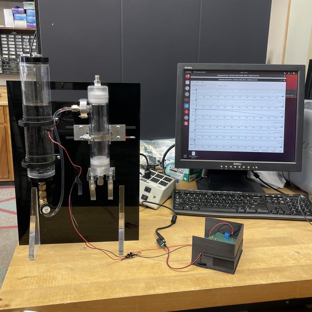 Image shows humidification chamber connected to Piezo atomizer circuit and test stand.