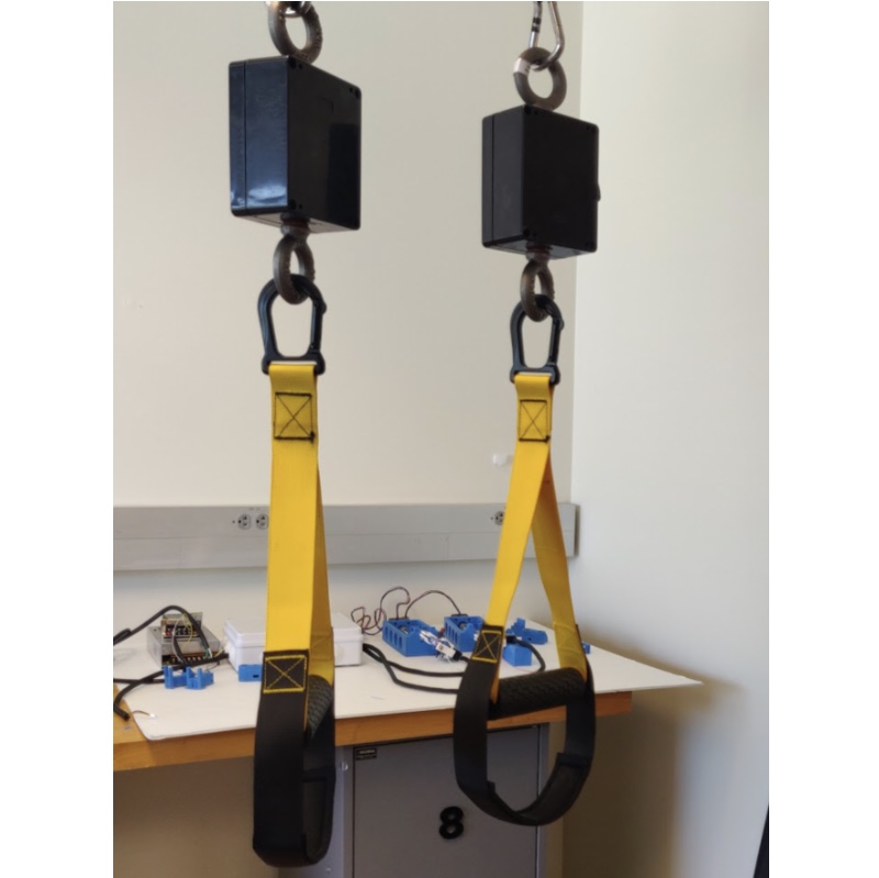 Image shows 2 black boxes on top of fabric pull up bar rings